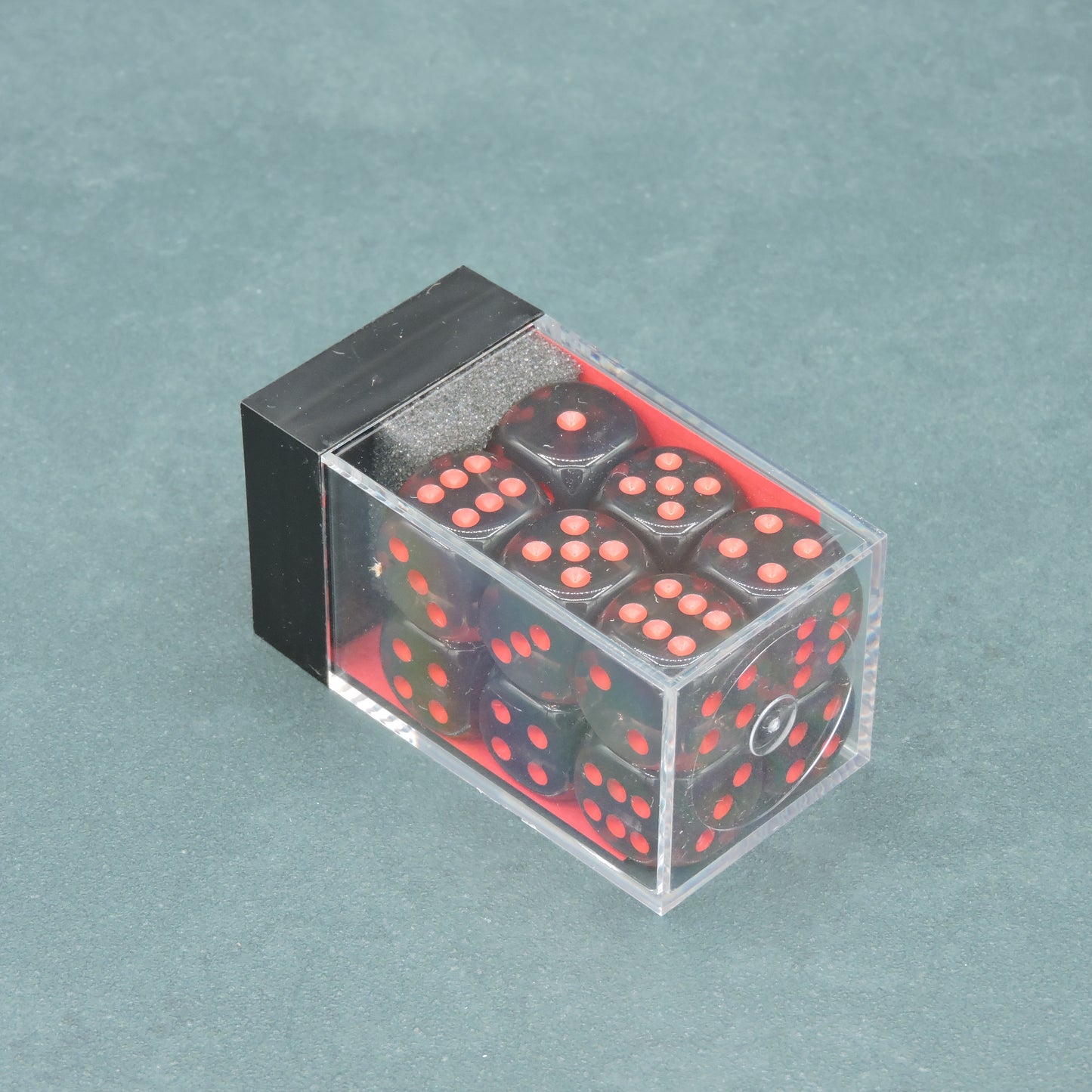 Smoke w/ red Translucent 16mm d6 Dice Block (12 dice)