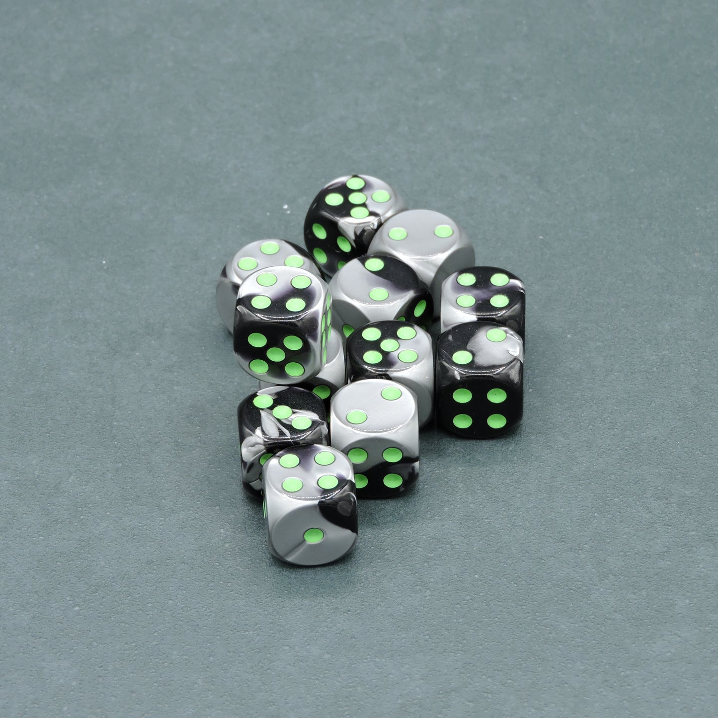 Black-Grey w/ green Gemini 16mm d6 Dice Block (12 dice)